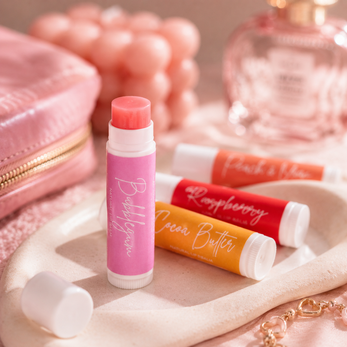 Balm tubes with colorful packaging on a soft surface