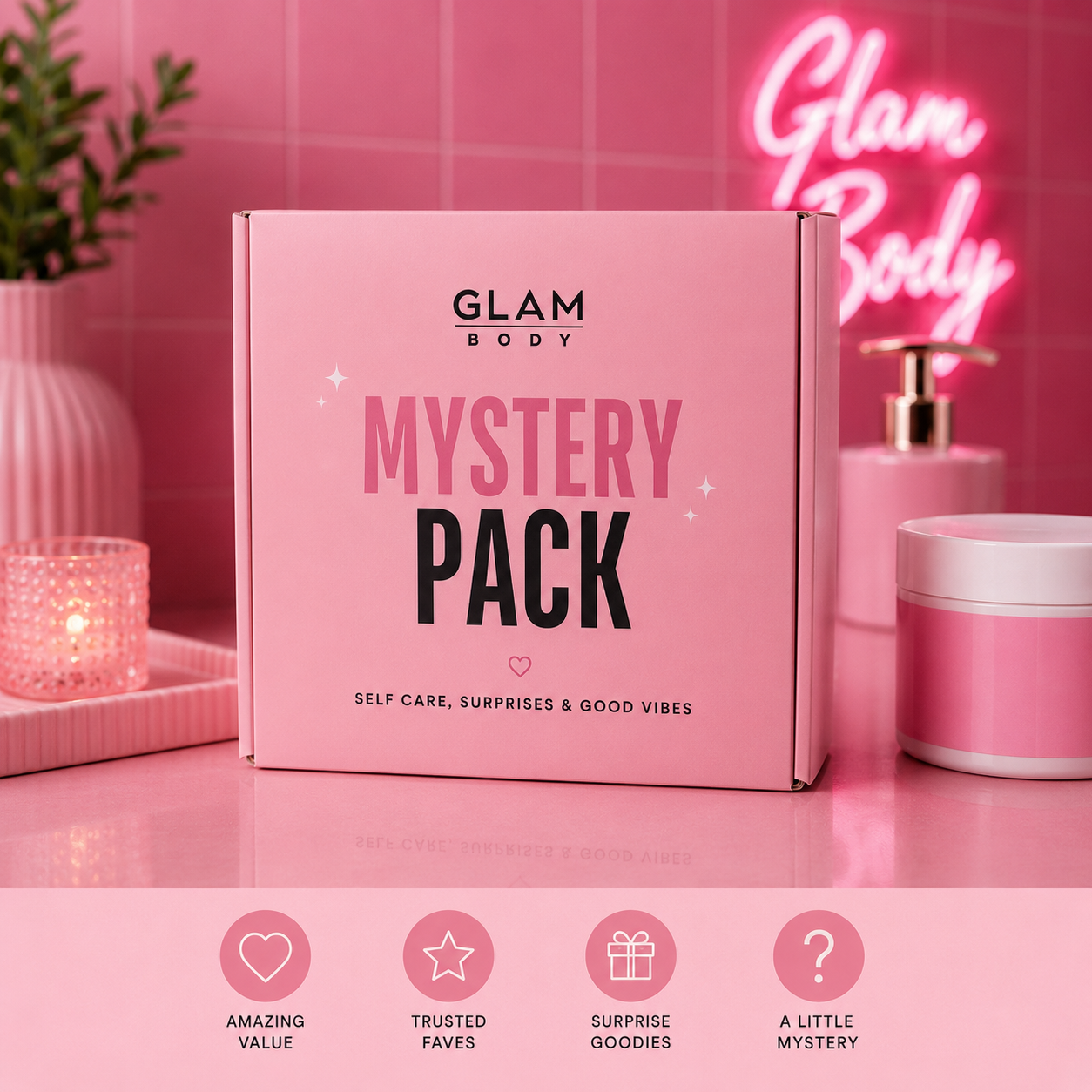 A pink GLAM BODY 'Mystery Pack' box is displayed on a pink reflective surface with pink bathroom-themed props, including a glowing pink 'Glam Body' neon sign in the background. The bottom of the image features a banner with four pink icons and text describing the mystery pack qualities: 'Amazing Value', 'Trusted Faves', 'Surprise Goodies', and 'A Little Mystery'.
