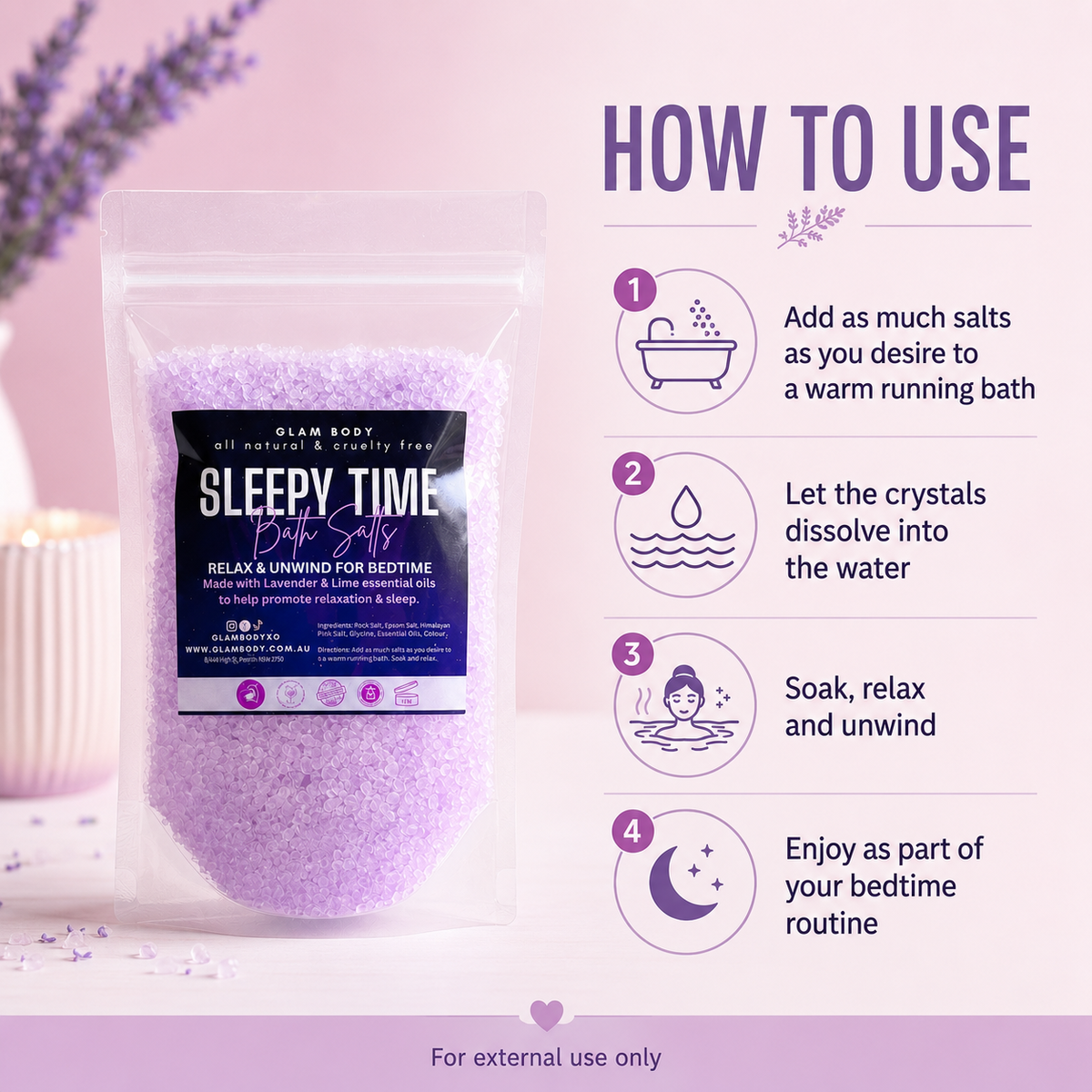 A stand-up pouch of Glam Body 'Sleepy Time' bath salts shown on a soft pink background with a lavender sprig and a candle prop. The package has a black label with white and purple text.