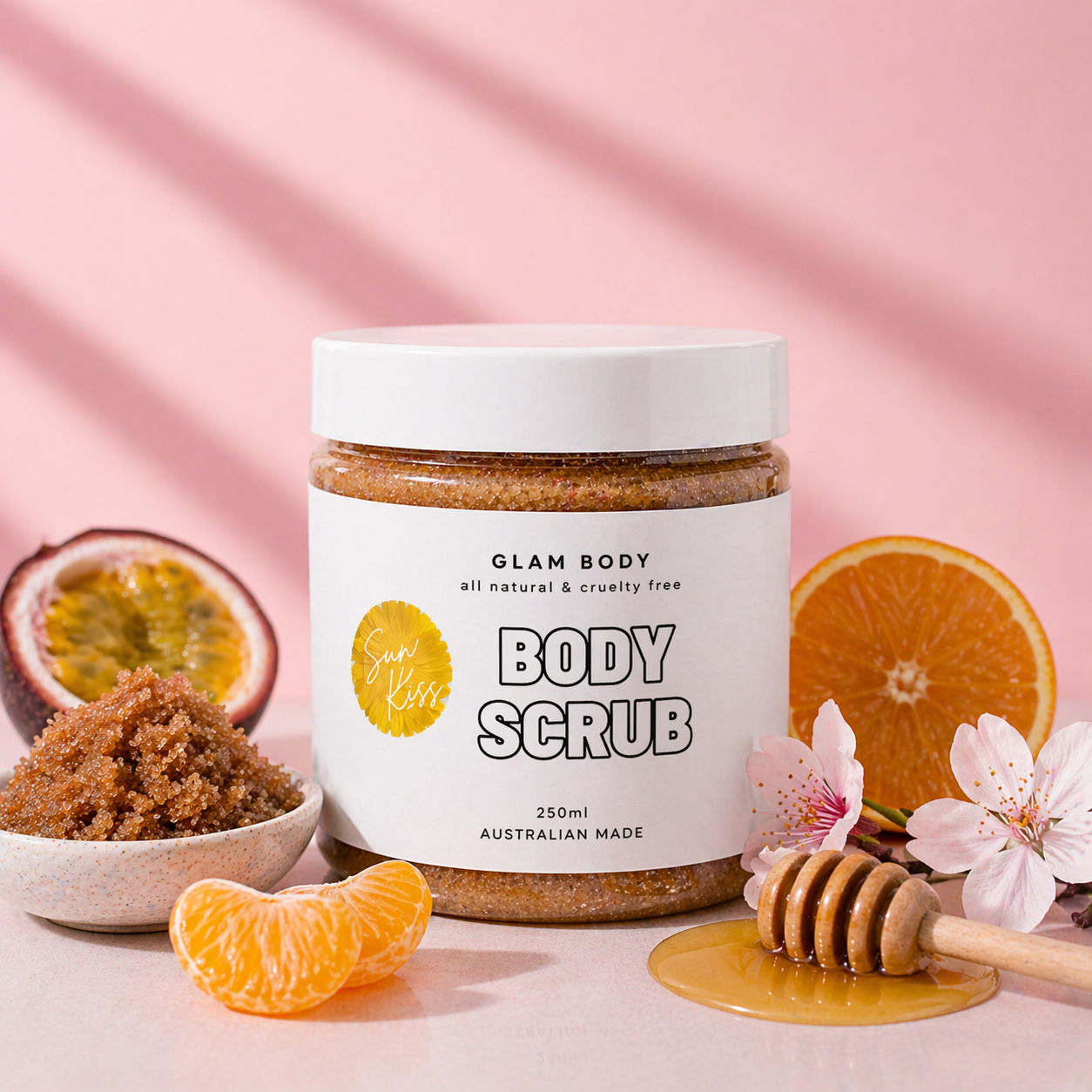 Jar of Glam Body body scrub with ingredients on a pink background