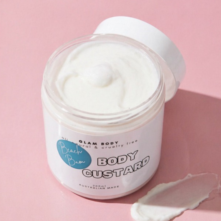 Jar of body custard with a visible brand label on a pink background