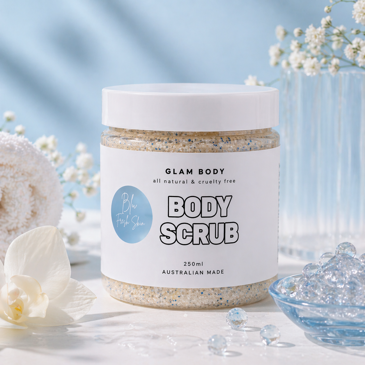 Jar of Glam Body body scrub with flowers and a blue background