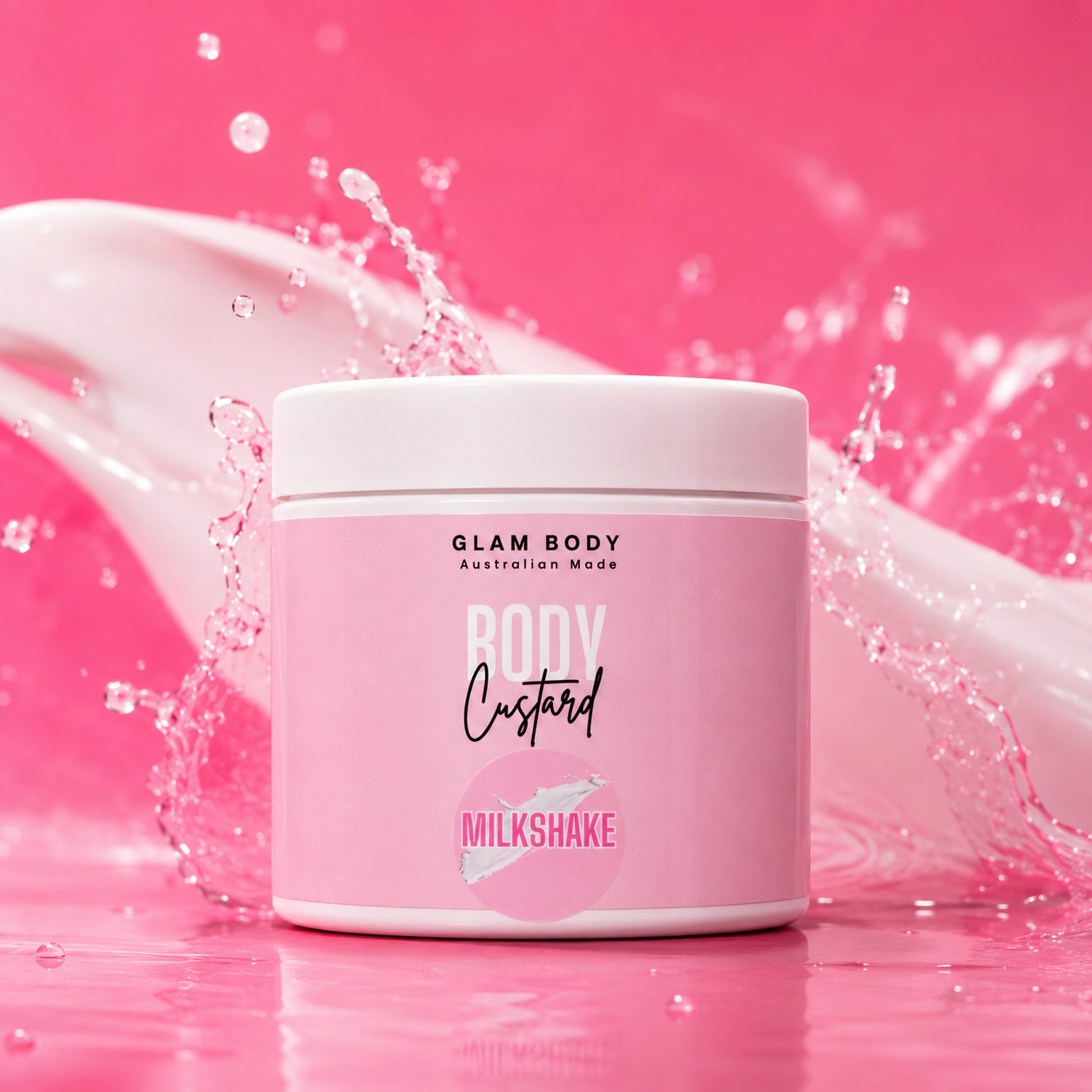 A pink jar of Glam Body Custard in the Milkshake scent, set against a vibrant pink background with a white high-heeled shoe and water splashes.
