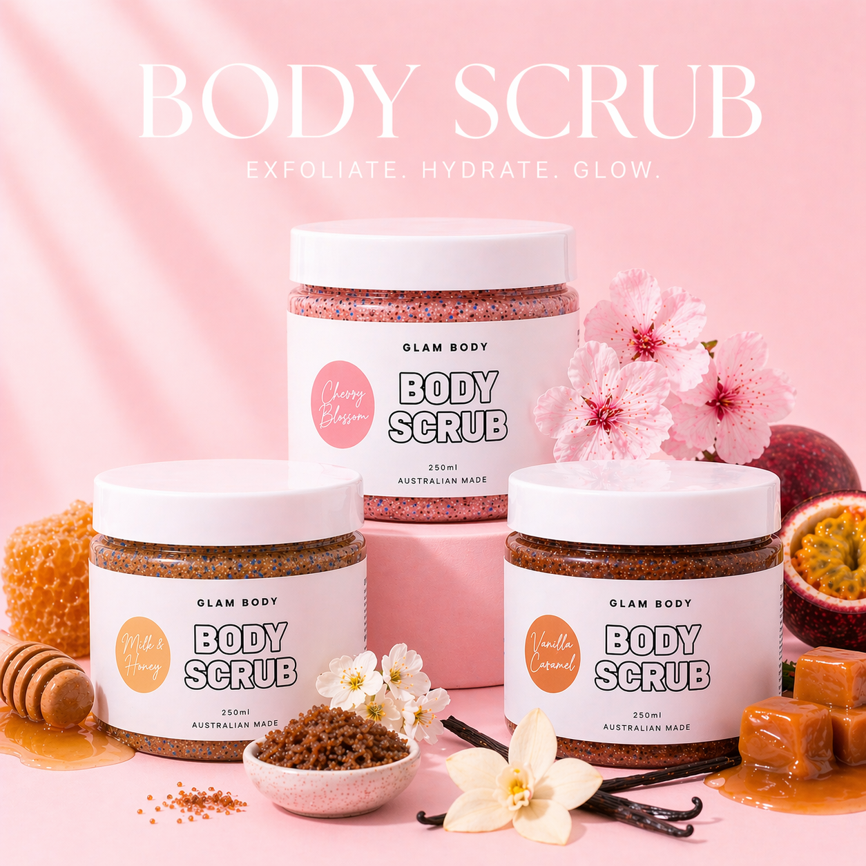 Three jars of Glam Body body scrub on a pink background with flowers and honeycomb.