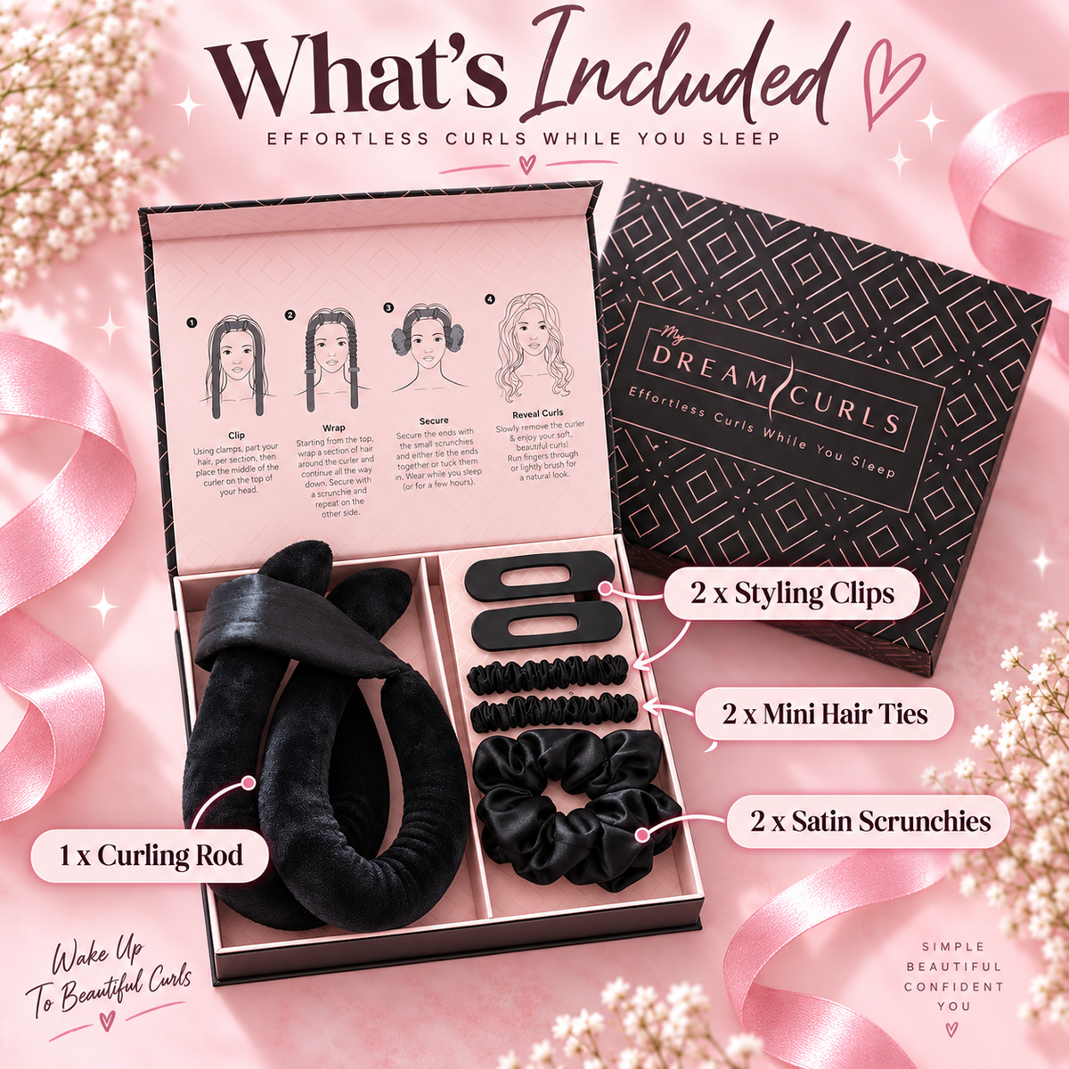 A hair curling kit shown in an open pink box with included accessories labeled: 1 curling rod, 2 styling clips, 2 mini hair ties, and 2 satin scrunchies. The set includes a black velvet headband, black clips, black mini ties, and black scrunchies, alongside a black patterned box and an instruction insert.