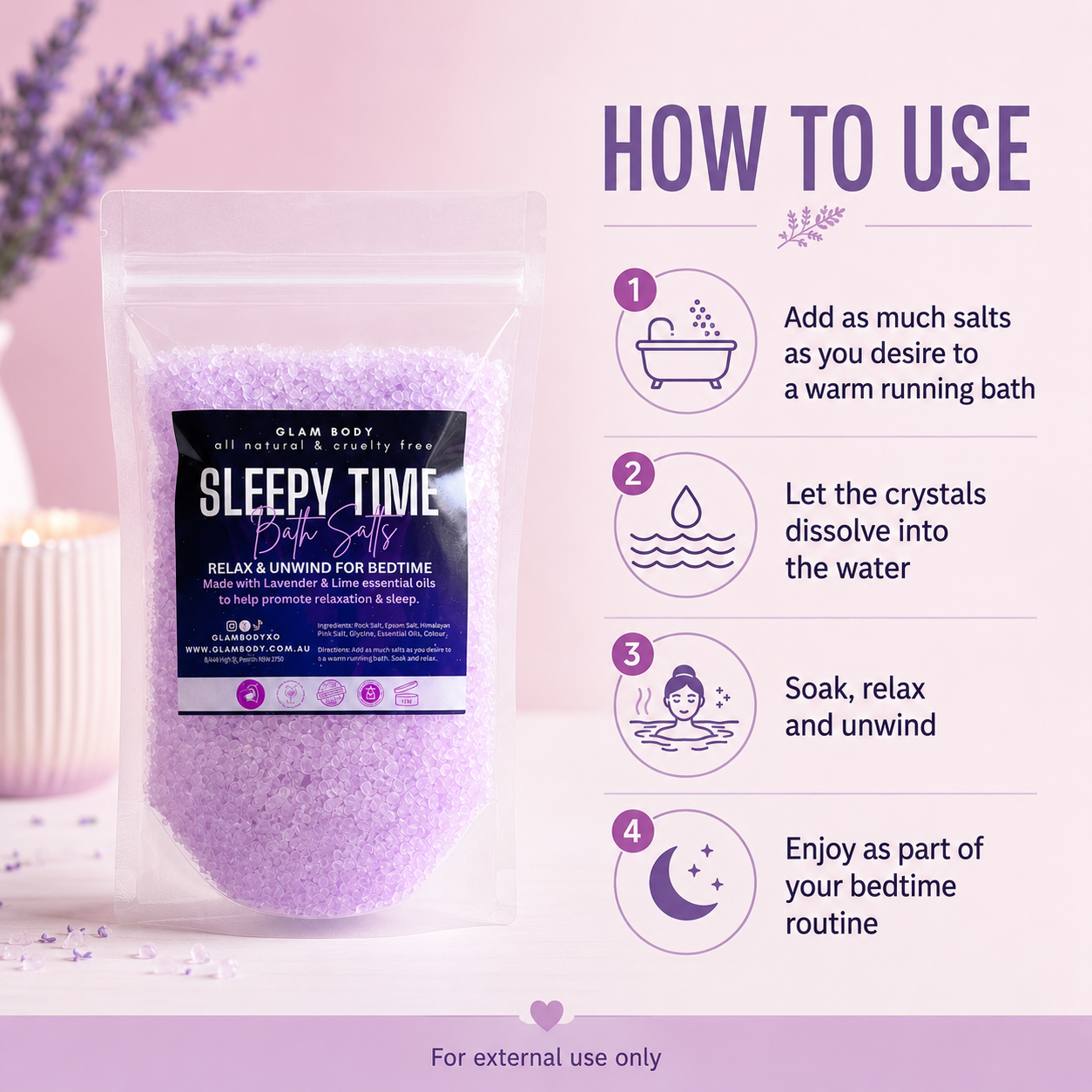 A stand-up pouch of Glam Body 'Sleepy Time' bath salts shown on a soft pink background with a lavender sprig and a candle prop. The package has a black label with white and purple text.