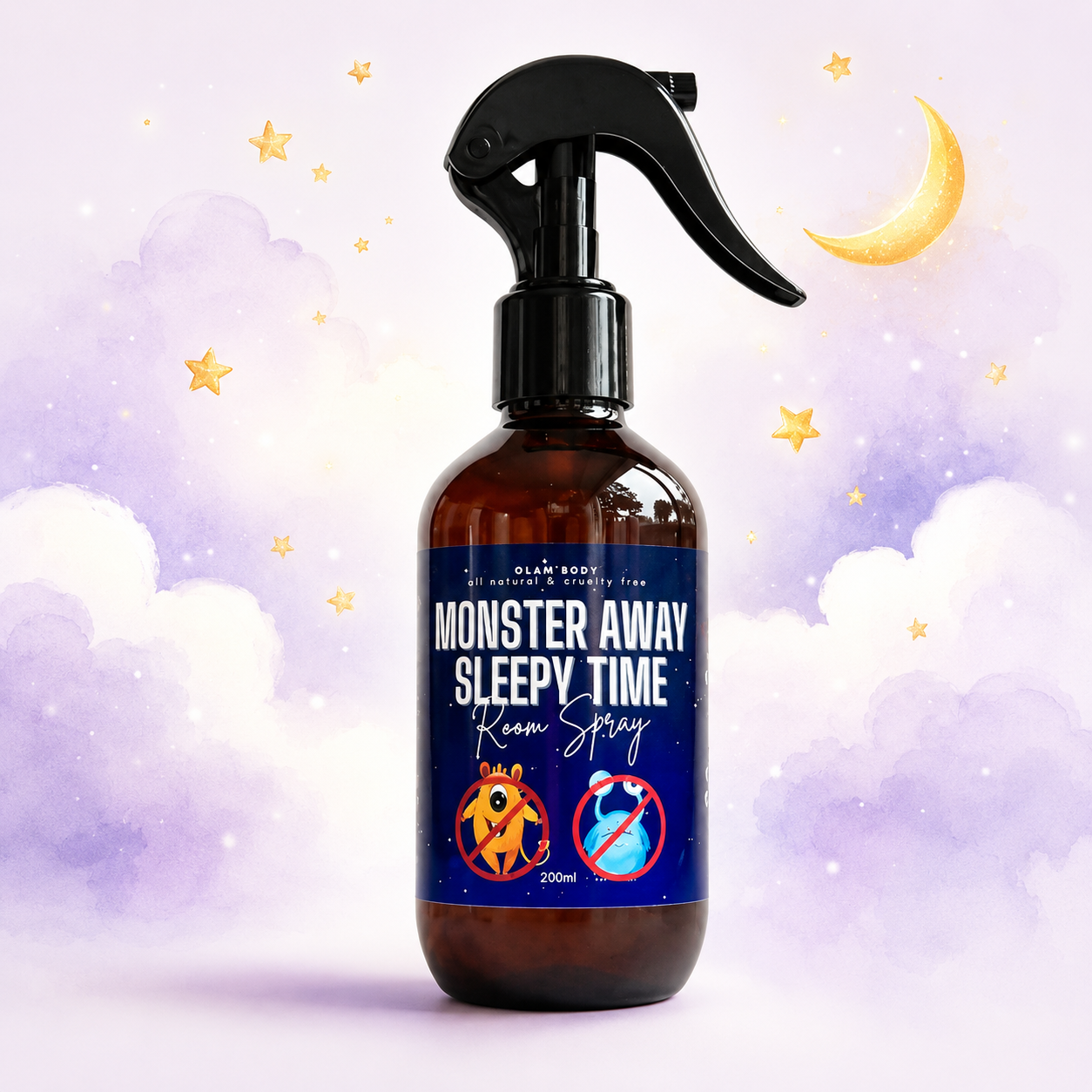 An amber glass spray bottle with a black trigger sprayer and a dark blue label reading 'Monster Away Sleepy Time Room Spray' on a whimsical pastel background with clouds, stars, and a crescent moon.