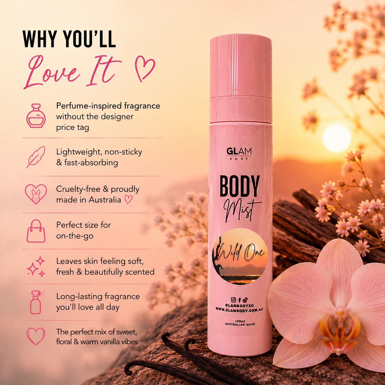 Pink body mist bottle with vanilla beans and flowers on a warm-toned background